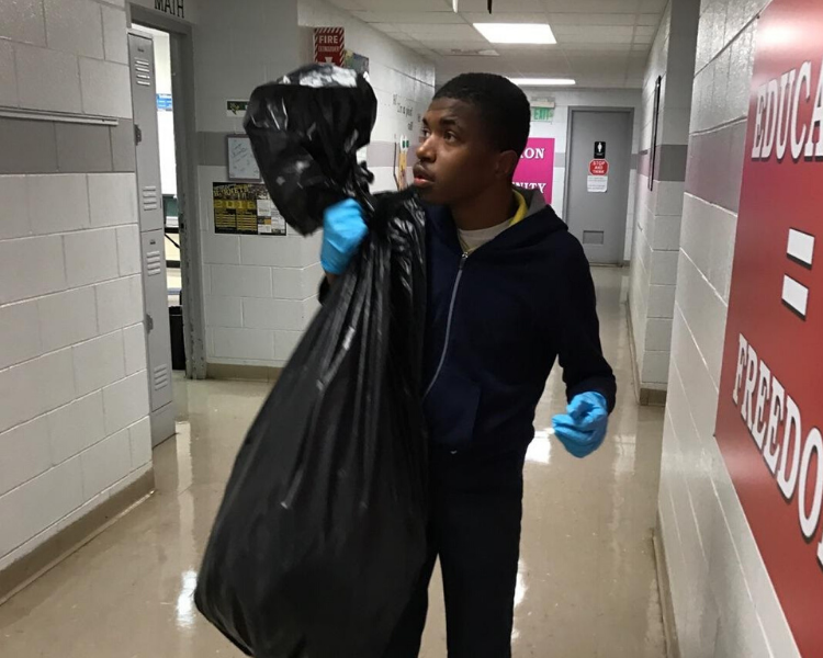 Malik taking trash out.