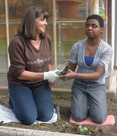 Two women gardening.