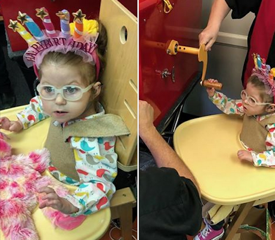 Mayzie wearing a birthday crown stuffing a bear at Build-a-Bear.